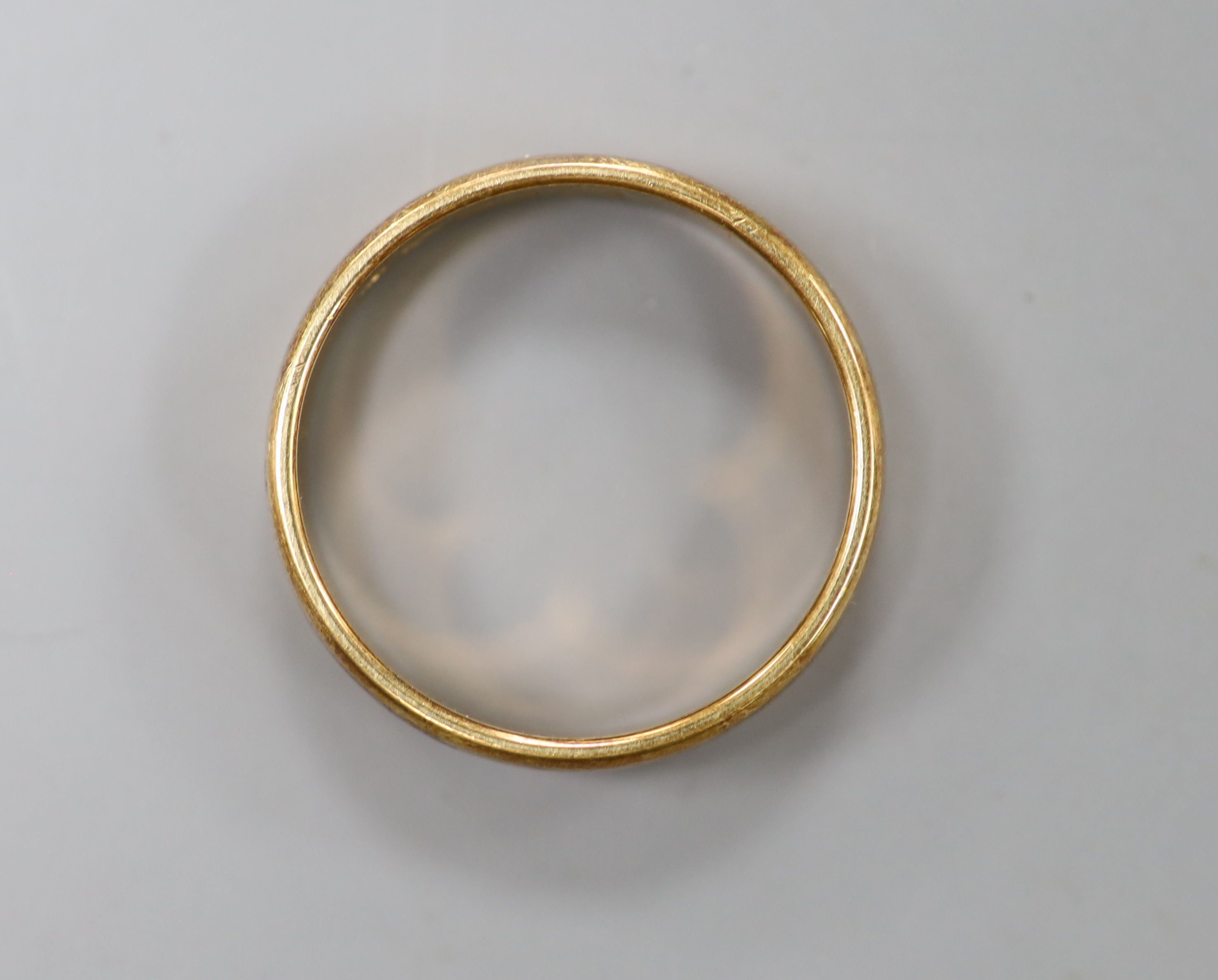 A modern 585 yellow metal wedding band, size W, 6.1 grams.